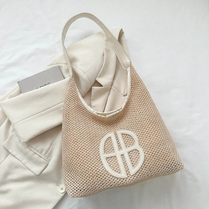 A niche hollowed-out design bag for women in 2025, a fashionable straw-woven single-shoulder bag and an underarm tote bag