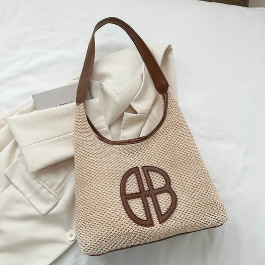 A niche hollowed-out design bag for women in 2025, a fashionable straw-woven single-shoulder bag and an underarm tote bag